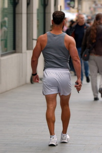 Athletic man on sidewalk